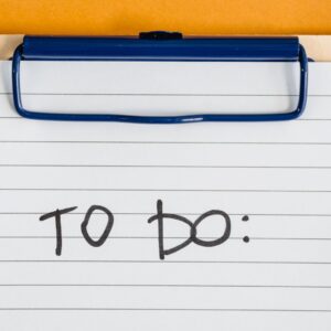 Clean and simple image of a to-do list on a clipboard with lined paper.